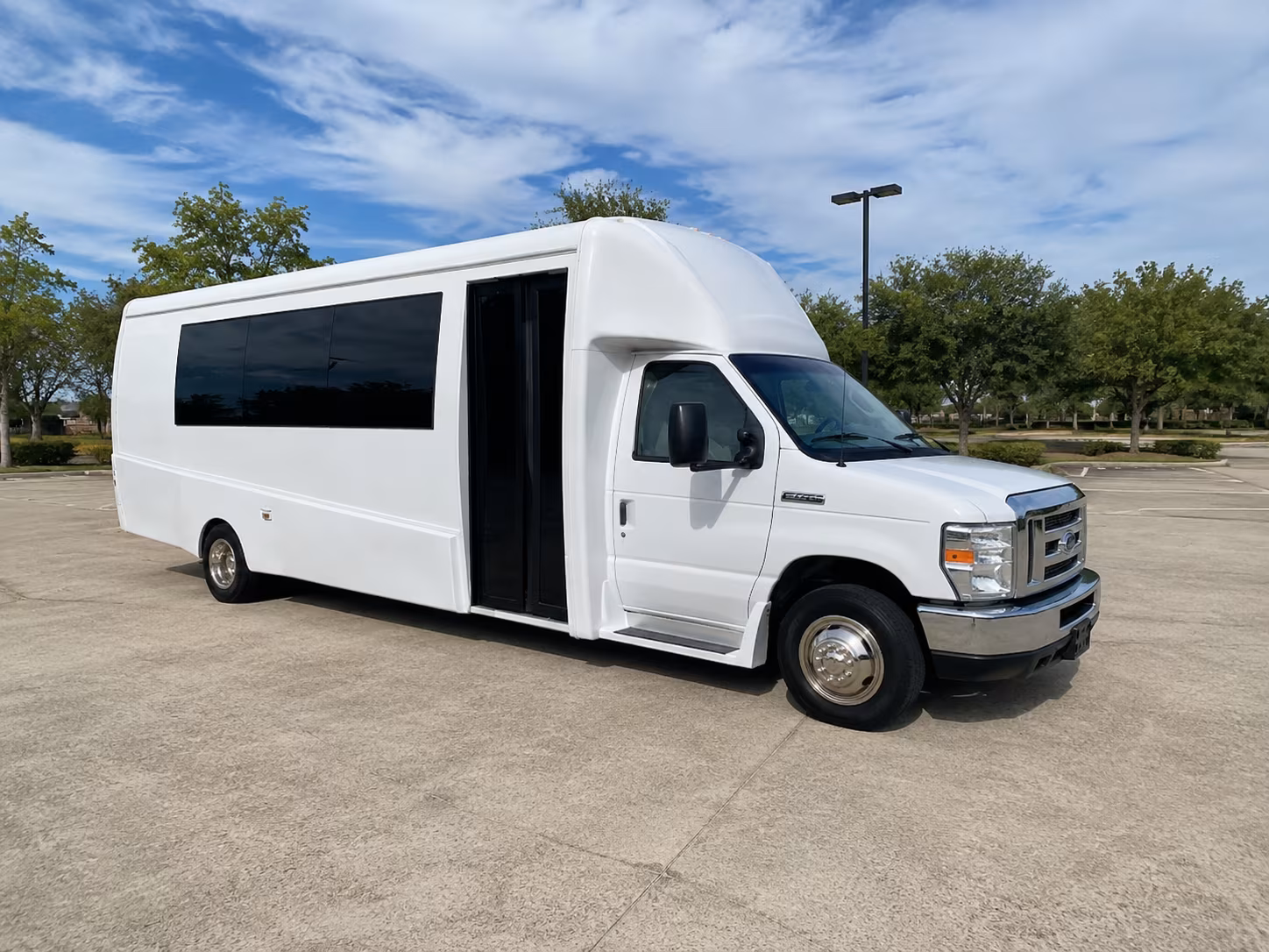 Group beside a Mercedes Sprinter limo in Tampa